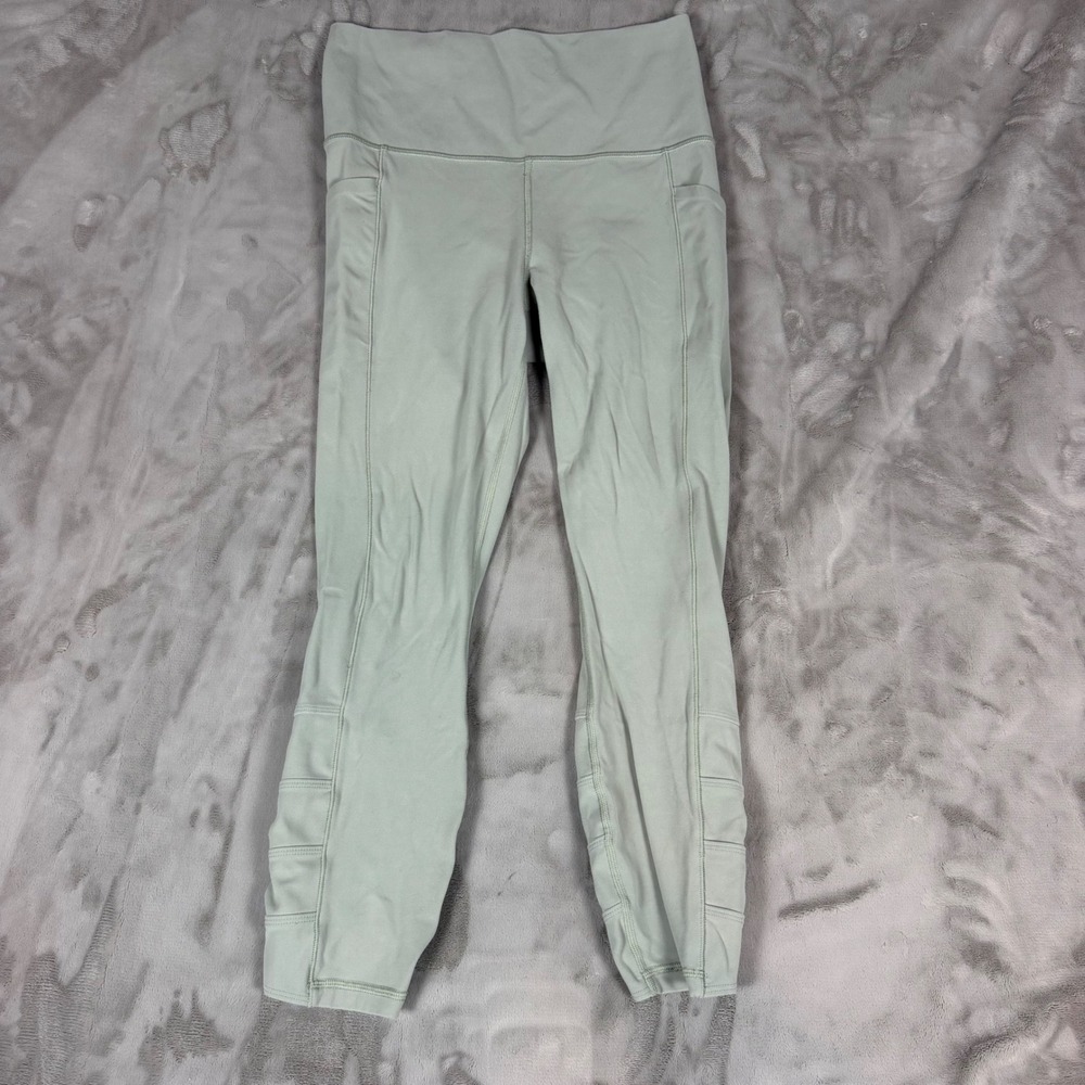 Athleta Salutation Stash Pocket 7/8 Tight Sage Green Strappy Ladder Hem Small
